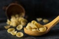 Pasta over wooden spoon dark food