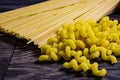 Pasta from the pack on the table scattered. Royalty Free Stock Photo