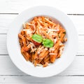 Pasta Pene with Bacon and Cherry Tomatoes. Italian dish Free space for your text. Royalty Free Stock Photo