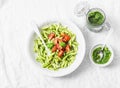 Pasta penne with arugula pesto and cherry tomatoes on light background Royalty Free Stock Photo