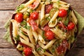 Pasta penne with fried ham, cherry tomatoes, zucchini and cheese Royalty Free Stock Photo