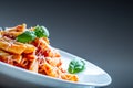 Pasta Penne with Tomato Bolognese Sauce, Parmesan Cheese and Basil on a Fork. Mediterranean food.Italian cuisine Royalty Free Stock Photo