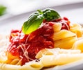 Pasta Penne with Tomato Bolognese Sauce, Parmesan Cheese and Basil on a Fork. Mediterranean food.Italian cuisine Royalty Free Stock Photo