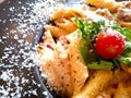 Pasta plate top view, macaroni with cherry tomato, salad and parmesan cheese. Close up food photo