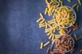 Pasta raw macaroni on bowl background, close up raw macaroni spiral pasta uncooked delicious whole grain fusilli pasta for cooking Royalty Free Stock Photo