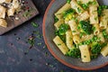 Pasta rigatoni with broccoli and green peas. Vegan menu. Dietary food. Flat lay.