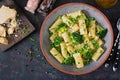 Pasta rigatoni with broccoli and green peas. Vegan menu. Dietary food. Flat lay. Royalty Free Stock Photo