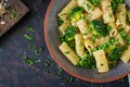 Pasta rigatoni with broccoli and green peas. Vegan menu. Dietary food. Flat lay. Royalty Free Stock Photo