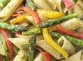Pasta in roasted asparagus, peppers with green pesto Royalty Free Stock Photo