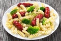 Pasta salad with broccoli and grilled sausages, close-up Royalty Free Stock Photo