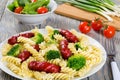 Pasta salad with broccoli and grilled sausages decorated with d Royalty Free Stock Photo