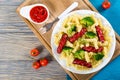 Pasta salad with broccoli and grilled sausages, top view Royalty Free Stock Photo