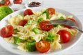 Pasta Salad with broccoli and tomato cherry with fork. vegetarian healthy food Royalty Free Stock Photo