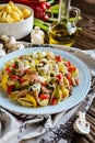 Pasta salad with chicken meat, bacon and vegetable