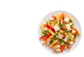 Pasta salad with chicken and vegetables. top view. isolated