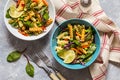 Pasta salad with fresh herbs spinach, vegetables and green peas Royalty Free Stock Photo