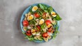 Pasta salad with quail eggs, tomatoes, rucola, mozzarella and basil