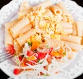 Pasta with salad from tomato and cabbage Royalty Free Stock Photo