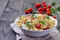 Pasta salad with tomato, mozzarella, pine nuts and basil Royalty Free Stock Photo