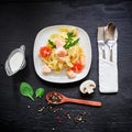Pasta with salmon and tomato with sauce on black background. Flat lay, top view Royalty Free Stock Photo