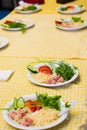 Pasta with sausage and tomatoes with greens on a white plate Royalty Free Stock Photo