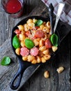 Pasta with sausages in tomato sauce with basil and cheese Royalty Free Stock Photo