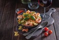 Pasta with seafood, cherry and basil