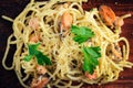 Pasta with seafood, prawns and mussels, sprinkled with leaves of Royalty Free Stock Photo