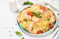 Pasta seafood with shrimp on white table.