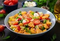 Pasta in the shape heart salad with tomatoes, cucumbers, olives, mozzarella and red onion Royalty Free Stock Photo