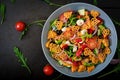 Pasta in the shape heart salad with tomatoes, cucumbers, olives, mozzarella and red onion Greek style. Royalty Free Stock Photo