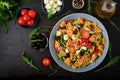 Pasta in the shape heart salad with tomatoes, cucumbers, olives, mozzarella and red onion Royalty Free Stock Photo