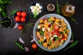 Pasta in the shape heart salad with tomatoes, cucumbers, olives, mozzarella and red onion Royalty Free Stock Photo