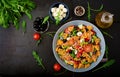 Pasta in the shape heart salad with tomatoes, cucumbers, olives, mozzarella and red onion Royalty Free Stock Photo