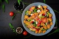 Pasta in the shape heart salad with tomatoes, cucumbers, olives, mozzarella and red onion Royalty Free Stock Photo
