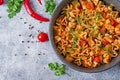 Pasta in the shape of hearts with chicken and tomatoes in tomato sauce.