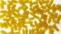 Pasta in the shape of a spiral. Macro photo of pasta. Pasta background. Pasta in bulk Royalty Free Stock Photo