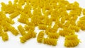 Pasta in the shape of a spiral. Macro photo of pasta. Pasta background. Pasta in bulk Royalty Free Stock Photo