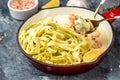 Pasta with Shrimp and bechamel sauce in a pan. Food recipe background. Close up Royalty Free Stock Photo