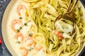 Pasta with Shrimp and bechamel sauce in a pan. Food recipe background. Close up Royalty Free Stock Photo