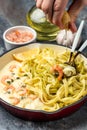 Pasta with Shrimp and bechamel sauce in a pan. Food recipe background. Close up Royalty Free Stock Photo