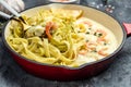 Pasta with Shrimp and bechamel sauce in a pan. Food recipe background. Close up Royalty Free Stock Photo