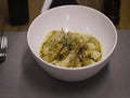 Pasta with shrimp being served on the table