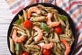 Pasta with shrimp, tomato and pesto sauce close-up. horizontal t Royalty Free Stock Photo