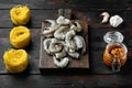 Pasta with shrimp, tomato and pesto sauce ingredients, on old dark  wooden table Royalty Free Stock Photo