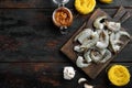 Pasta with shrimp, tomato and pesto sauce ingredients, on old dark  wooden table , top view flat lay, with copy space for text Royalty Free Stock Photo