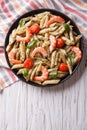 Pasta with shrimp, tomato and pesto sauce. vertical top view Royalty Free Stock Photo