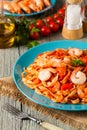 Pasta with prawns, tomatoes, and herbs. Royalty Free Stock Photo