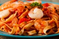 Pasta with prawns, tomatoes, and herbs. Royalty Free Stock Photo