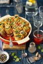 Pasta snails made with lasagne and stuffed with spinach and feta cheese